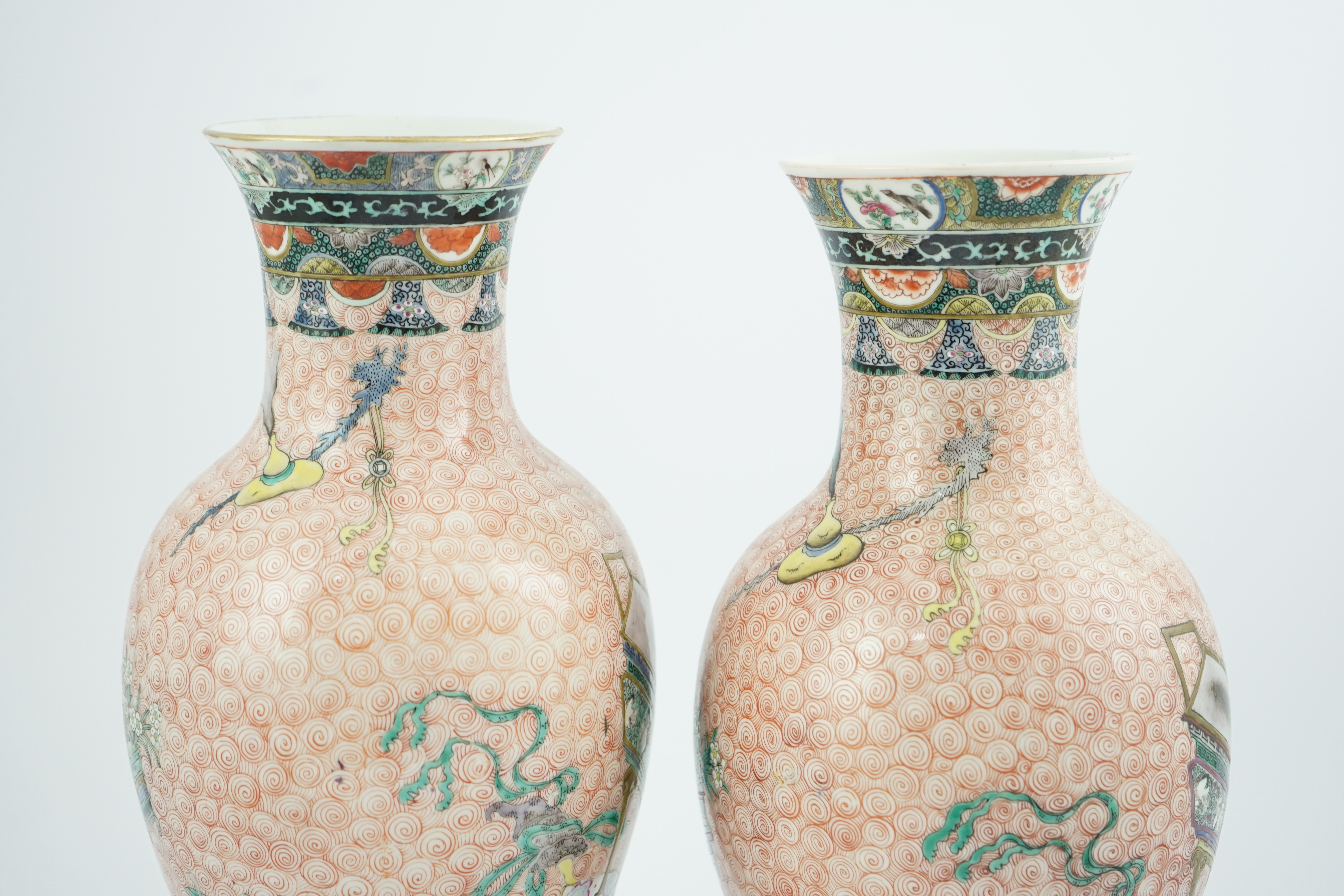 A near pair of Chinese famille rose ‘Hundred Antiques’ baluster vases, Kangxi mark, early 20th century